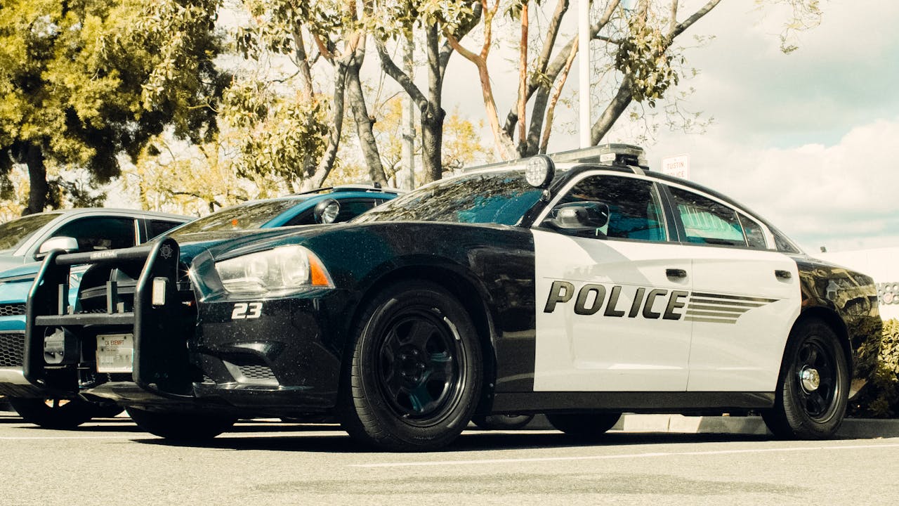 Image of a police car on a sunny day.